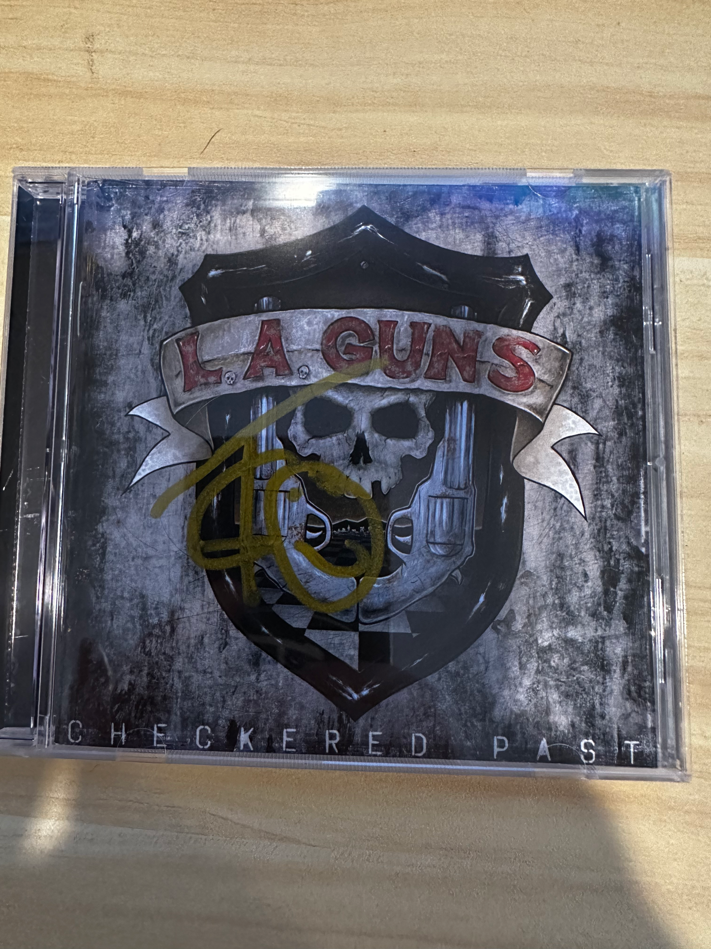 **SIGNED** LA Guns Checkered Past